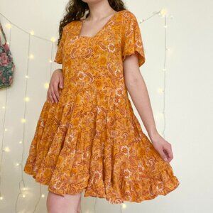 Orange floral and paisley print baby doll tiered dress